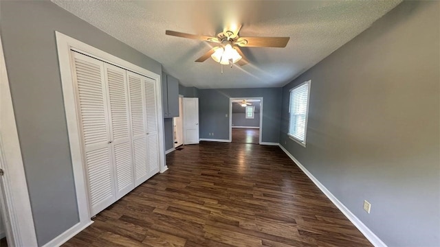 3728 N Lake Blvd, Danville, IL 61832 - hall with a textured ceiling, dark wood-style floors, and baseboards