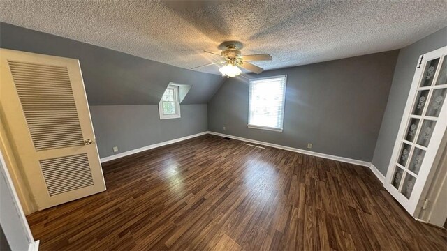 3728 N Lake Blvd, Danville, IL 61832 - bonus room with a textured ceiling, a ceiling fan, a heating unit, dark wood finished floors, and baseboards
