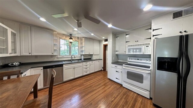 3728 N Lake Blvd, Danville, IL 61832 - kitchen with appliances with stainless steel finishes, a sink, dark countertops, a ceiling fan, and recessed lighting