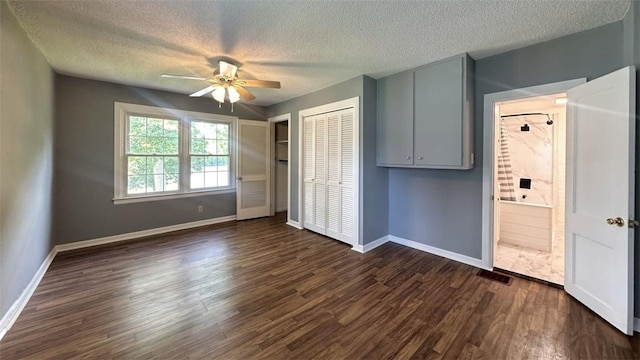 3728 N Lake Blvd, Danville, IL 61832 - unfurnished bedroom with baseboards, dark wood-style flooring, a textured ceiling, a closet, and a ceiling fan