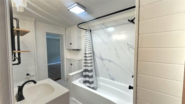 3728 N Lake Blvd, Danville, IL 61832 - bathroom with shower / tub combo, vanity, and a textured ceiling