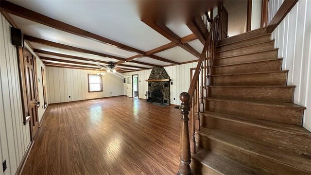 3728 N Lake Blvd, Danville, IL 61832 - unfurnished living room featuring stairway, ceiling fan, a fireplace, wood finished floors, and wooden walls