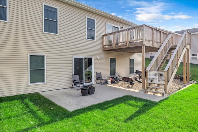 back of house with a yard, a deck, stairway, and a patio area