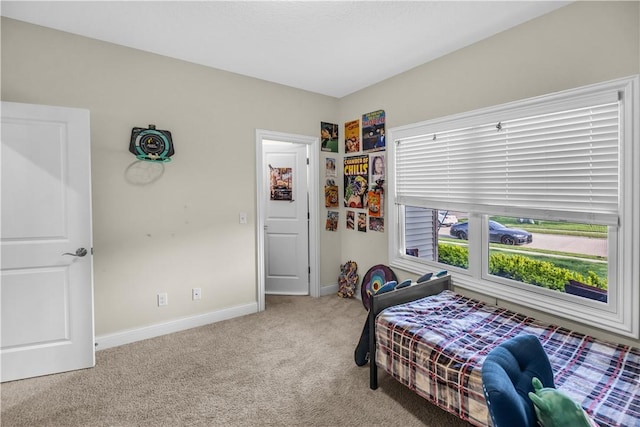 bedroom featuring carpet flooring and baseboards