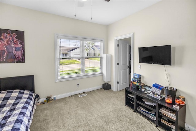 bedroom with baseboards, carpet, and ceiling fan