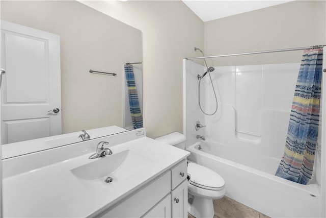 full bath featuring vanity, shower / tub combo, tile patterned floors, and toilet
