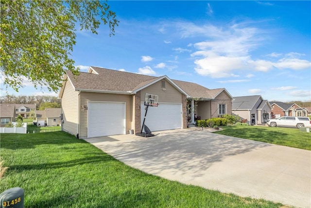 ranch-style home featuring an attached garage, driveway, a residential view, and a front yard