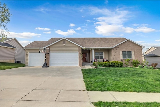 ranch-style home featuring a porch, a front lawn, an attached garage, and driveway