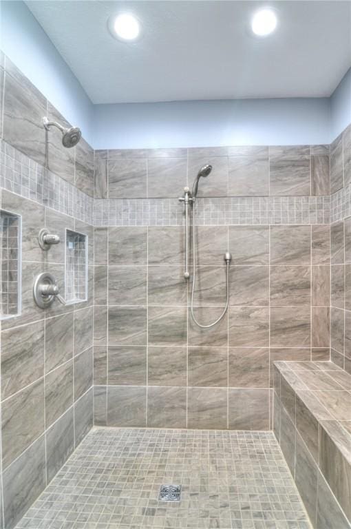 bathroom featuring a tile shower