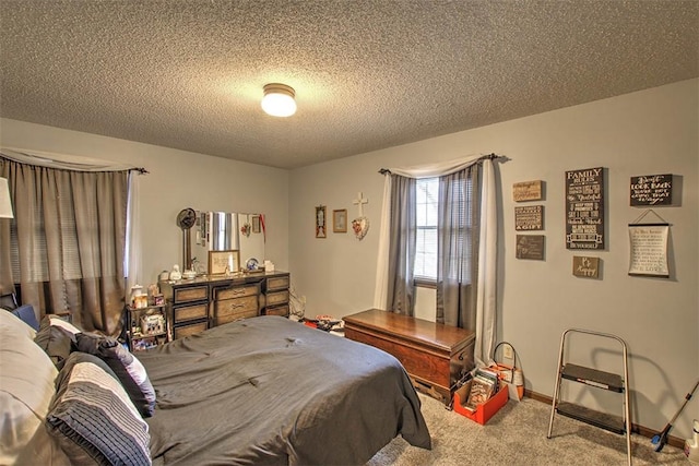 carpeted bedroom featuring a textured ceiling and baseboards