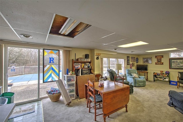 carpeted office with a paneled ceiling and visible vents