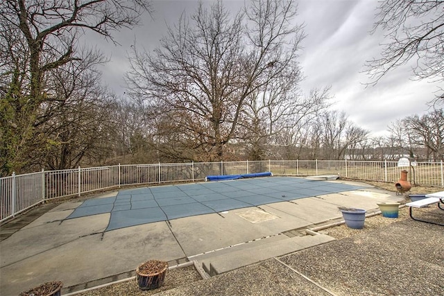 view of pool with a fenced in pool, a patio area, and fence