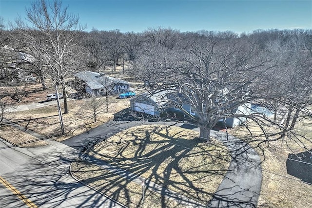 drone / aerial view with a view of trees