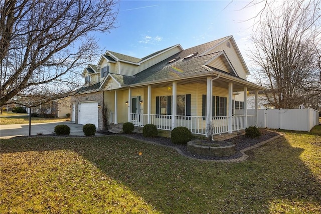 view of front of home with a porch, a garage, and a front lawn