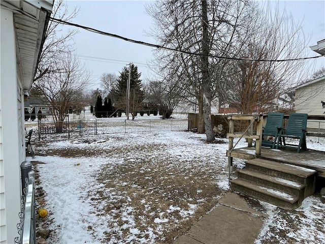 view of yard layered in snow