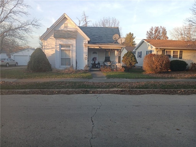 view of front of property with a garage and a porch