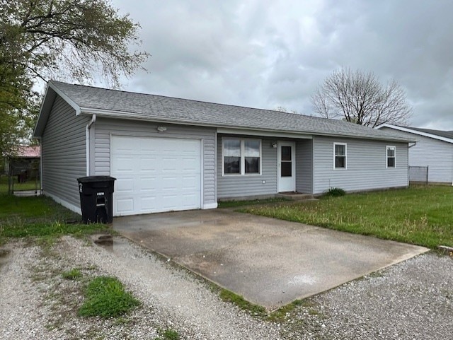 view of front facade with concrete driveway, a shingled roof, and an attached garage