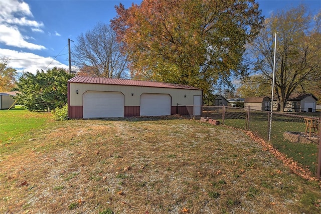 garage featuring a lawn