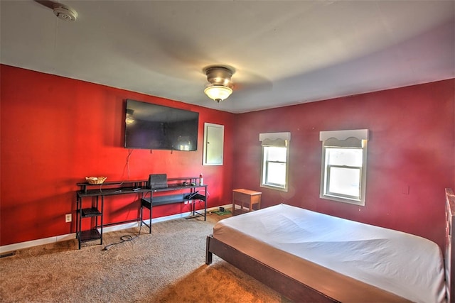 bedroom with ceiling fan and carpet floors