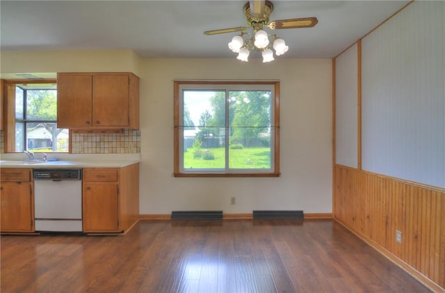 635 E N St, Warrensburg, IL 62573 - kitchen with white dishwasher, light countertops, dark wood finished floors, ceiling fan, and a sink