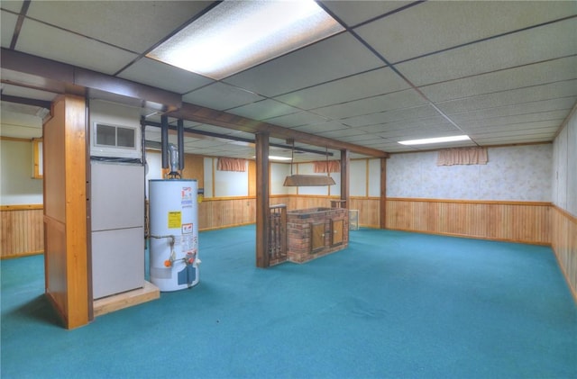 635 E N St, Warrensburg, IL 62573 - finished below grade area featuring gas water heater, carpet, a drop ceiling, wainscoting, and wooden walls