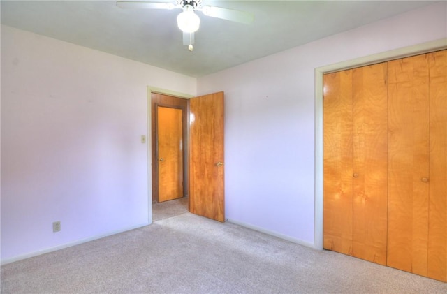 635 E N St, Warrensburg, IL 62573 - unfurnished bedroom featuring carpet floors, a closet, ceiling fan, and baseboards