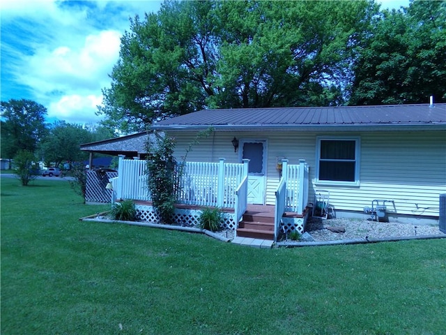 210 Kennedy Ave, Pana, IL 62557 - bungalow-style home with a front yard and metal roof
