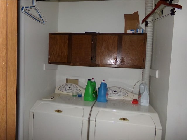 210 Kennedy Ave, Pana, IL 62557 - washroom featuring cabinet space and washing machine and clothes dryer