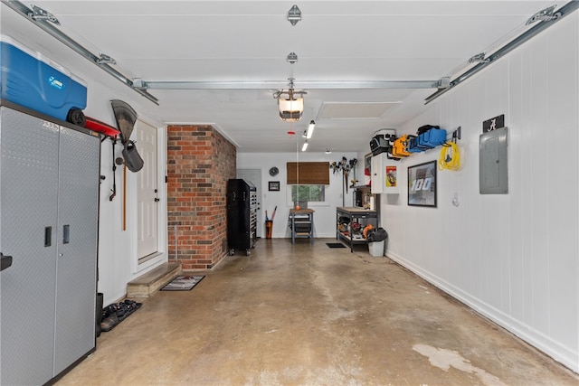 garage featuring electric panel and a garage door opener