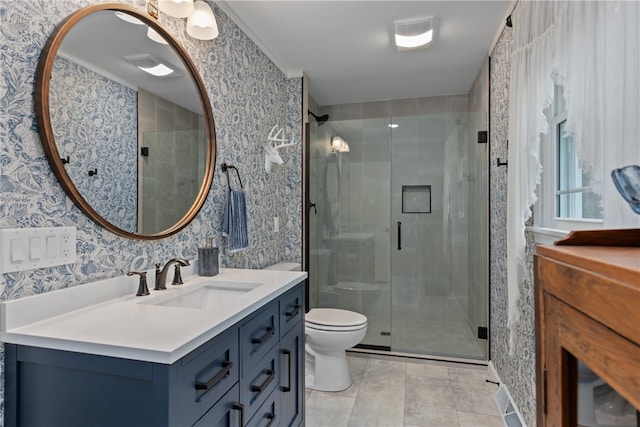 bathroom with tile patterned floors, crown molding, an enclosed shower, toilet, and vanity