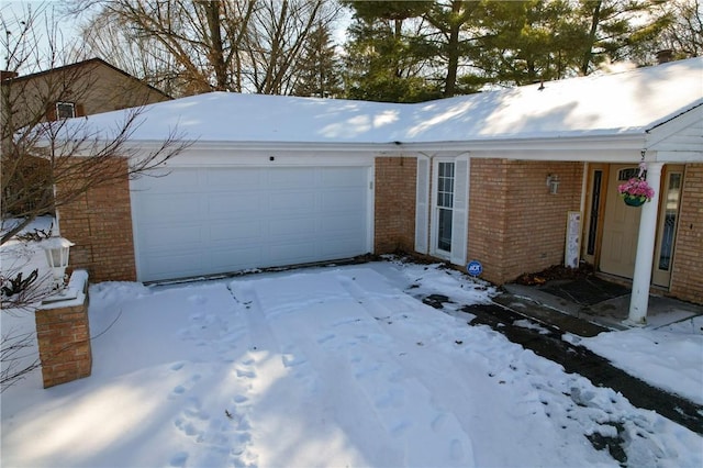 view of snow covered garage