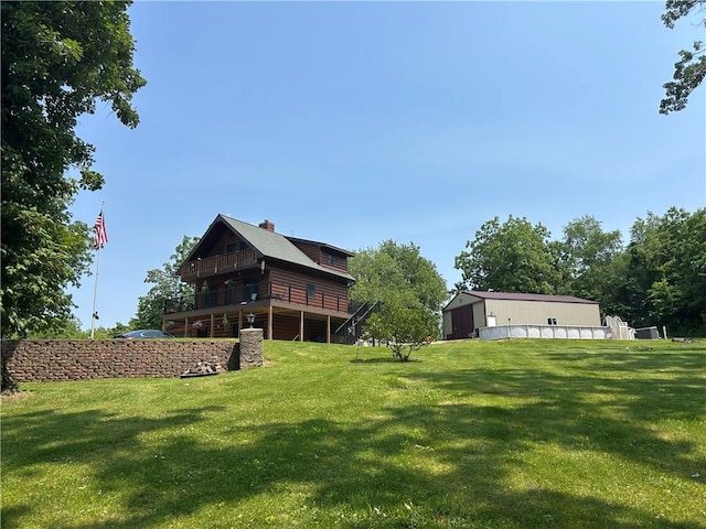 10760 E 1600th St, Cambridge, IL 61238 - view of green lawn with a wooden deck and an outbuilding