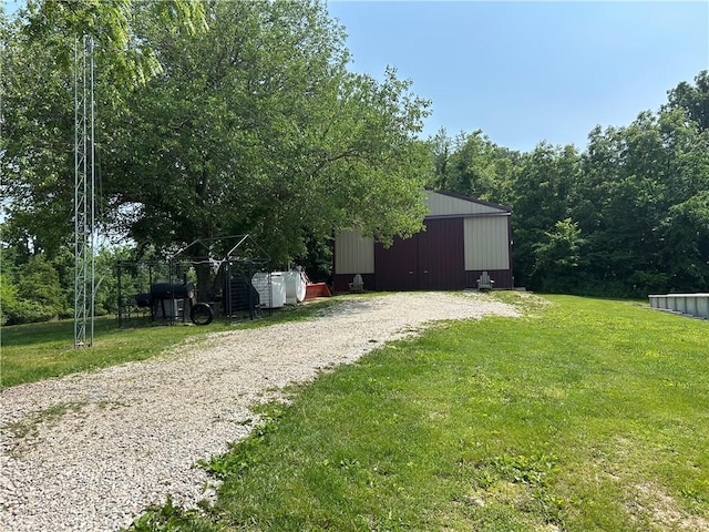 10760 E 1600th St, Cambridge, IL 61238 - view of grassy yard featuring a pole building and an outdoor structure