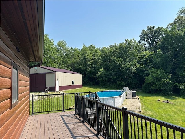 10760 E 1600th St, Cambridge, IL 61238 - wooden terrace featuring a yard, an outdoor structure, and an outdoor pool