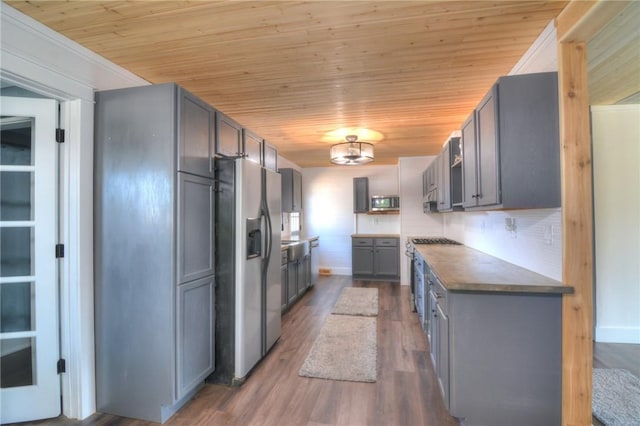 235 W Lawrence St, Illiopolis, IL 62539 - kitchen with appliances with stainless steel finishes, gray cabinets, wood ceiling, dark wood finished floors, and dark countertops