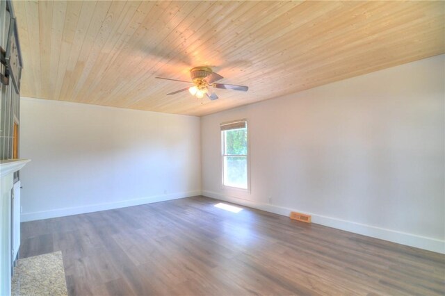 235 W Lawrence St, Illiopolis, IL 62539 - unfurnished room with wooden ceiling, ceiling fan, and wood finished floors