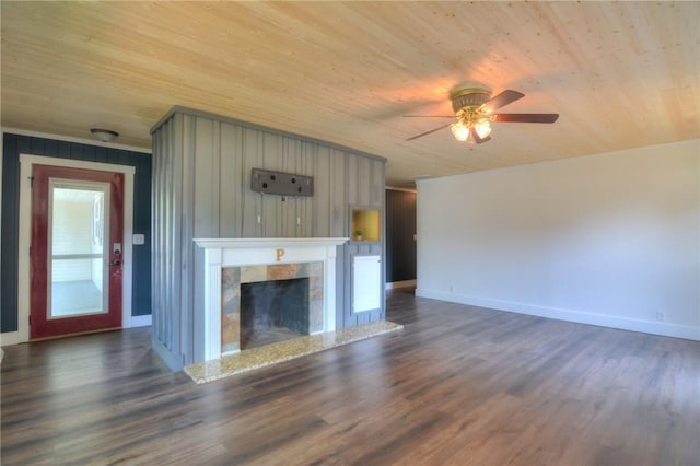 235 W Lawrence St, Illiopolis, IL 62539 - unfurnished living room with wooden ceiling, ceiling fan, dark wood-type flooring, and a fireplace