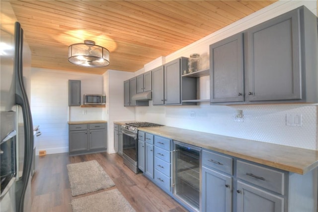 235 W Lawrence St, Illiopolis, IL 62539 - kitchen with stainless steel appliances, wine cooler, wooden ceiling, open shelves, and decorative backsplash