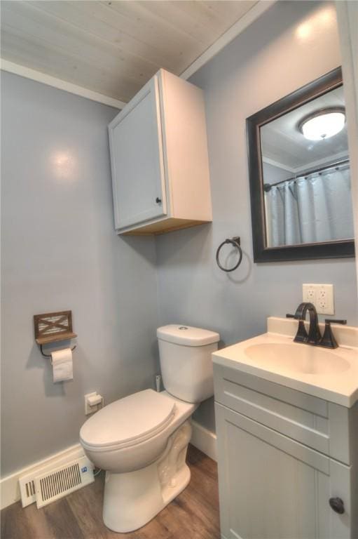 235 W Lawrence St, Illiopolis, IL 62539 - full bath with vanity, wood finished floors, and wooden ceiling