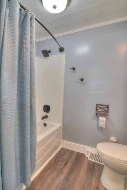 235 W Lawrence St, Illiopolis, IL 62539 - full bath with shower / tub combo with curtain, wood finished floors, and ornamental molding