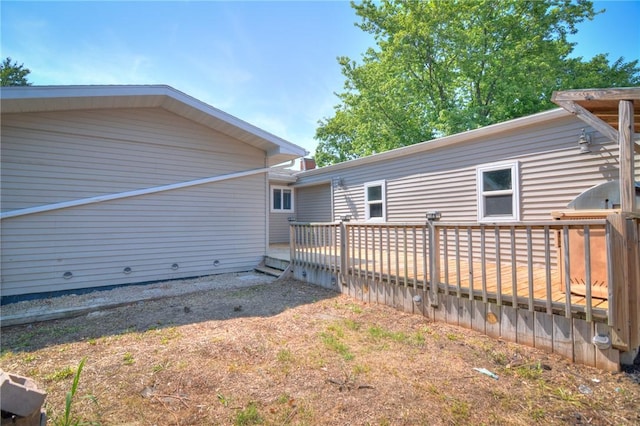 235 W Lawrence St, Illiopolis, IL 62539 - back of property featuring a wooden deck