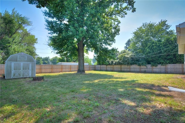 235 W Lawrence St, Illiopolis, IL 62539 - fenced backyard featuring a storage unit