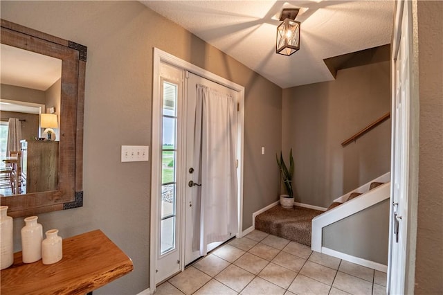 5334 Blue Mound Rd, Macon, IL 62544 - entrance foyer featuring stairway, light tile patterned floors, baseboards, and light carpet