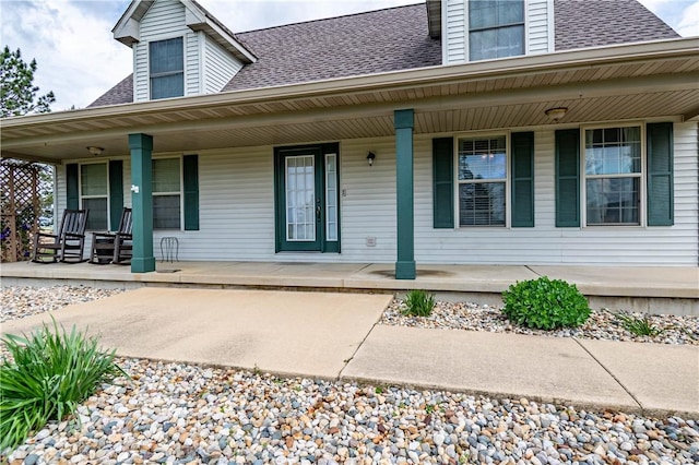 5334 Blue Mound Rd, Macon, IL 62544 - view of exterior entry featuring a porch and roof with shingles