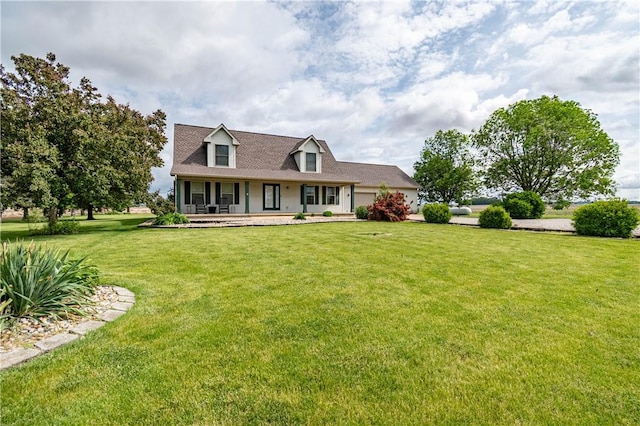 5334 Blue Mound Rd, Macon, IL 62544 - cape cod house with a porch, a front lawn, and an attached garage