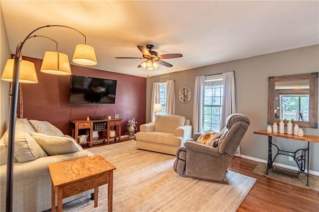 5334 Blue Mound Rd, Macon, IL 62544 - living area with wood finished floors, a ceiling fan, and baseboards