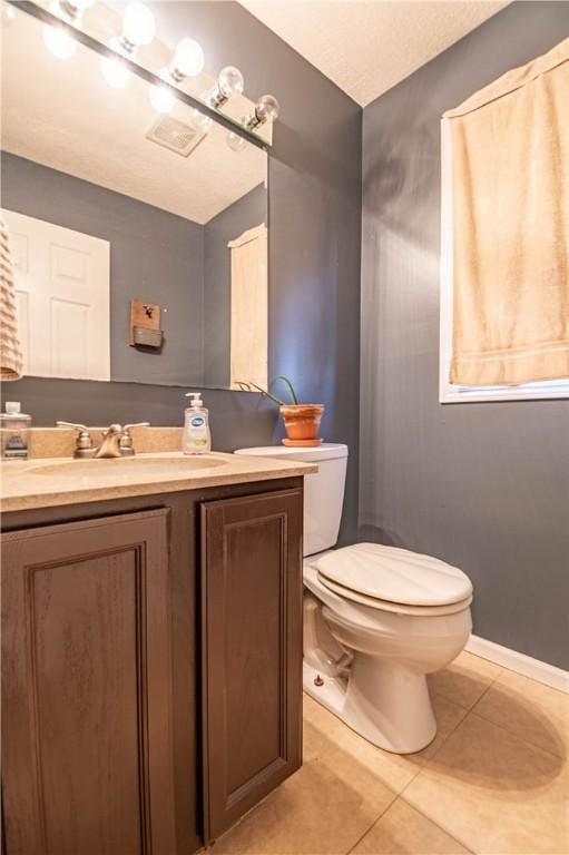 5334 Blue Mound Rd, Macon, IL 62544 - half bathroom with tile patterned flooring, toilet, vanity, and baseboards
