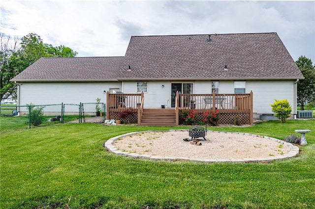 5334 Blue Mound Rd, Macon, IL 62544 - rear view of property featuring a fire pit, a deck, central AC unit, and a gate