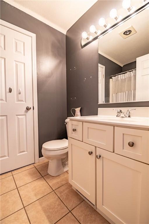5334 Blue Mound Rd, Macon, IL 62544 - full bath with vanity, tile patterned floors, and toilet
