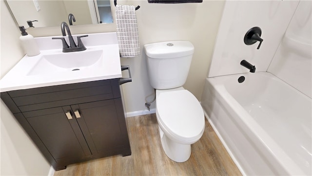 full bathroom featuring shower / bath combination, vanity, toilet, and wood finished floors